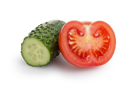 sliced tomato and cucumber, isolated on whiteの写真素材