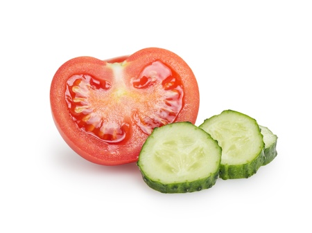 sliced tomato and cucumber, isolated on whiteの写真素材