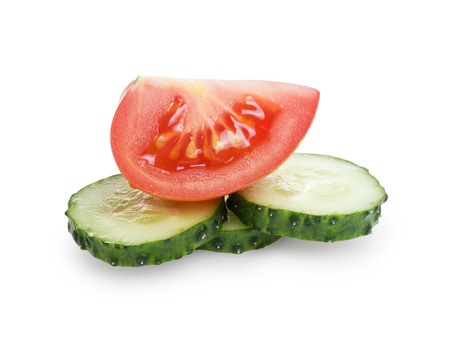 sliced tomato and cucumber, isolated on whiteの写真素材