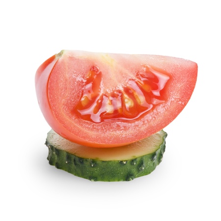 sliced tomato and cucumber, isolated on whiteの写真素材