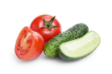 sliced tomato and cucumber, isolated on whiteの写真素材