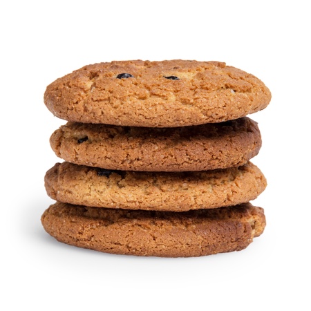 oat cookies with raisins in stack, isolated on whiteの写真素材