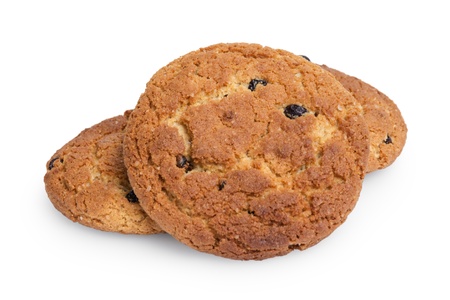 heap of oat cookies with raisins, isolated on whiteの写真素材