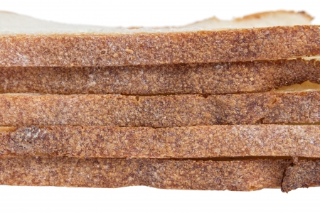 stack of slices white bread, isolated on white backgroundの写真素材