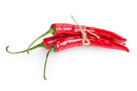 bunch of red chili peppers, isolated on whiteの写真素材