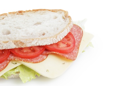 big sandwich with salami and cheese on white bread, isolatedの写真素材