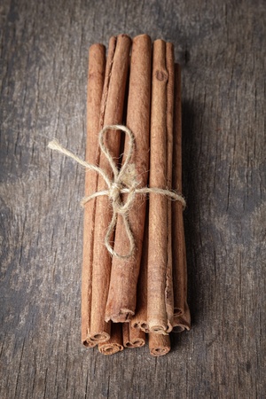 cinnamon sticks on old wooden table, selective focusの写真素材