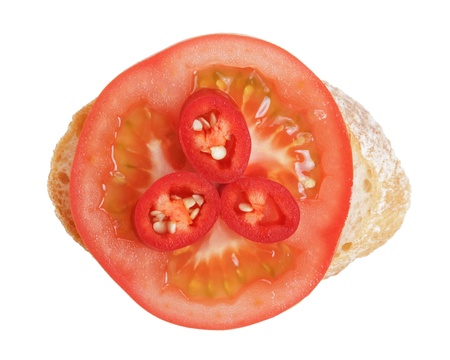 small sandwich with tomato and chili, isolated on whiteの写真素材
