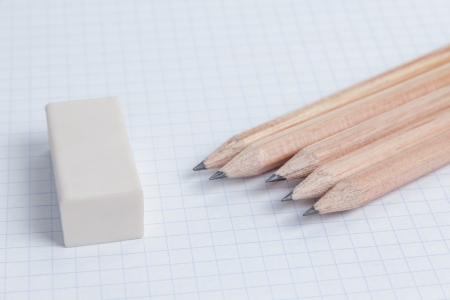 pencils and eraser on notebook page, school or business backgroundの写真素材
