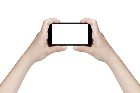 female teen hands holding generic smartphone, isolated on whiteの写真素材