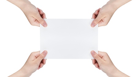 four female teen hands holding blank paper sheet, isolated on whiteの写真素材