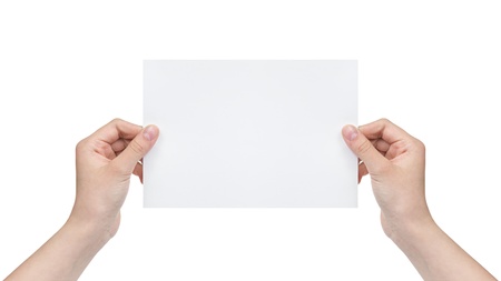 two female teen hands holding blank paper sheet, isolated on whiteの写真素材