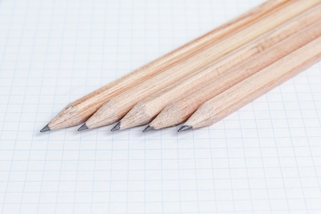 pencils on notebook page, school or business backgroundの写真素材