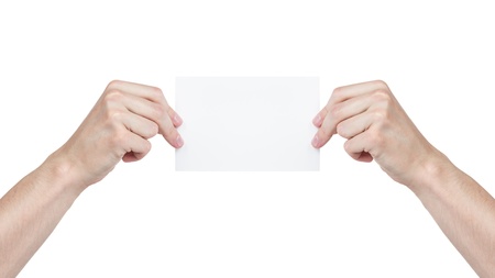 two adult man hands holding blank paper sheet, isolated on whiteの写真素材