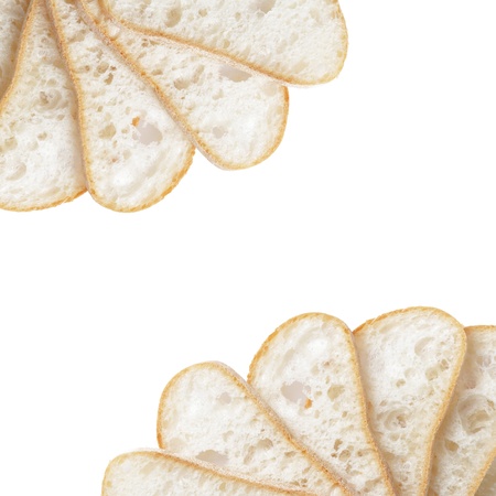 border from slices of fresh italian ciabatta bread, isolated on whiteの写真素材