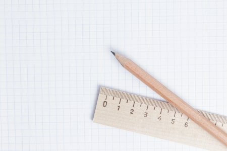 pencils and ruler on notebook page, school or business backgroundの写真素材