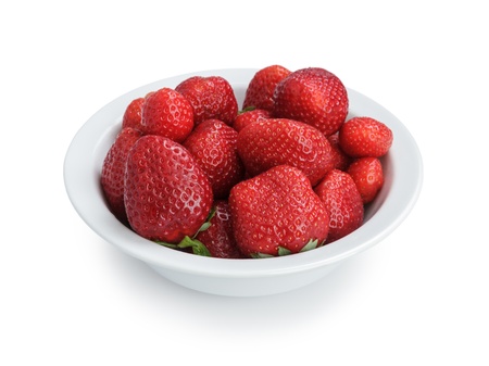 ripe strawberries in bowl, isolated on white backgroundの写真素材