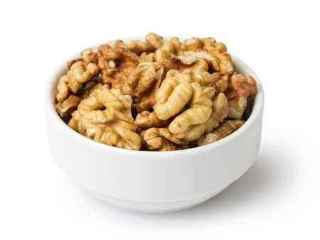 walnuts in bowl, isolated on white backgroundの写真素材