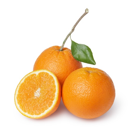 ripe round oranges with half, stem and leaf, isolated on white backgroundの写真素材