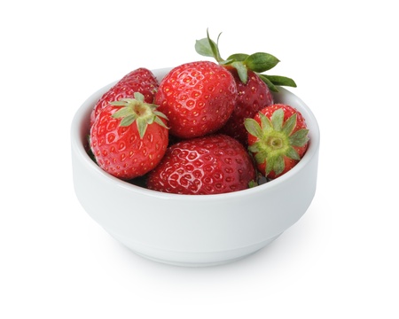 ripe strawberries in bowl, isolated on white backgroundの写真素材