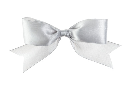 silver festive bow with tails made from ribbon, isolated on whiteの写真素材