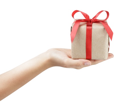 small gift box with ribbon bow in female hand, isolatedの写真素材