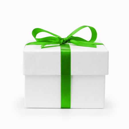 white textured gift box with green ribbon bow, isolated on whiteの写真素材