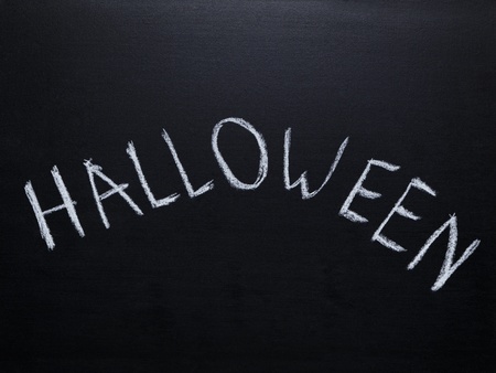 word halloween handwriten on chalkboard, halloween templateの写真素材