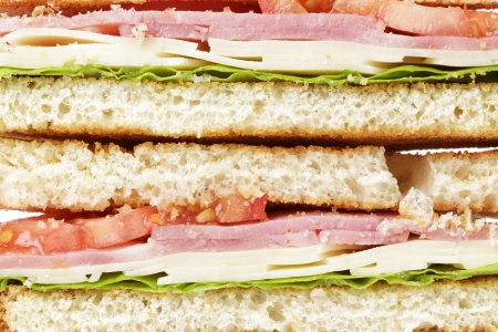 toasted sandwich with ham, cheese and vegetables, close upの写真素材