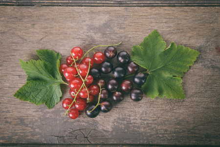 organic garden berries on old wood table, from aboveの写真素材