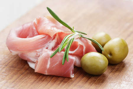 dried jamon slices on wood table, spanish traditional foodの写真素材