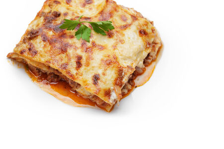 hot freshly made home lasagna, with white copy spaceの写真素材