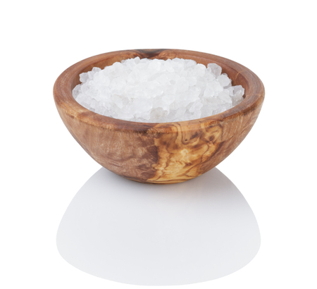 sea salt in wooden bowl for cooking or spa, isolatedの写真素材