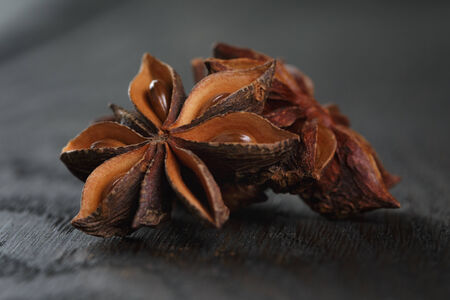 anise stars on old oak table, rustic styleの写真素材