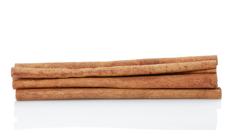 cinnamon cassia sticks, isolated on white backgroundの写真素材
