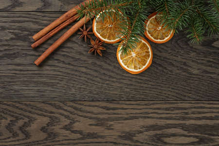 christmas background with cinnamon anise and oranges, oak tableの写真素材