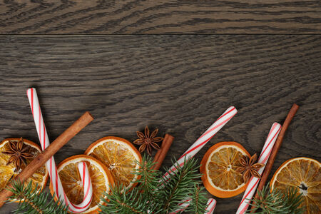 rustic christmas decorations on old oak table, vintage tonedの写真素材