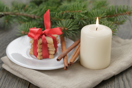 christmas composition with cookies and candle, rustic photoの写真素材