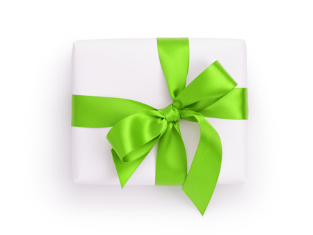 white gift box with green ribbon bow, from above on whiteの写真素材