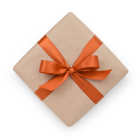 wrapped brown present box with orange ribbon bow, isolated on whiteの写真素材