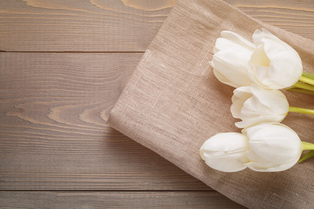 beautiful  white tulips on wooden background with copy space, springtimeの写真素材