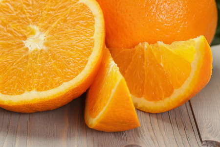 ripe spanish oranges on wood table, rustic photoの写真素材