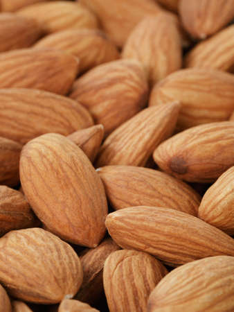 fresh almond peeled nuts background, close up photoの写真素材