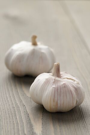 fresh garlic on wood tableの写真素材