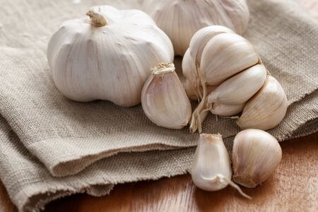fresh organic garlic on sack clothの写真素材