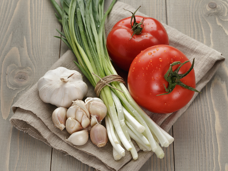 fresh organic vegetables for salad or bruschettaの写真素材