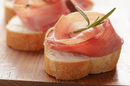 dried jamon slices on wood table, spanish traditional foodの写真素材