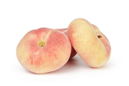 asian flat peaches isolated on white backgroundの写真素材