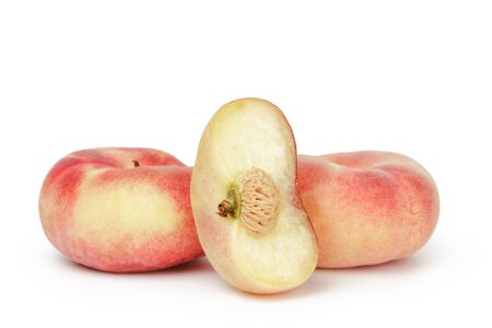 asian flat peaches isolated on white backgroundの写真素材
