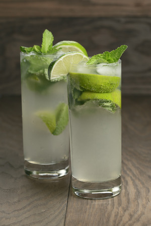 two mojito cocktails on old oak table, rustic styleの写真素材